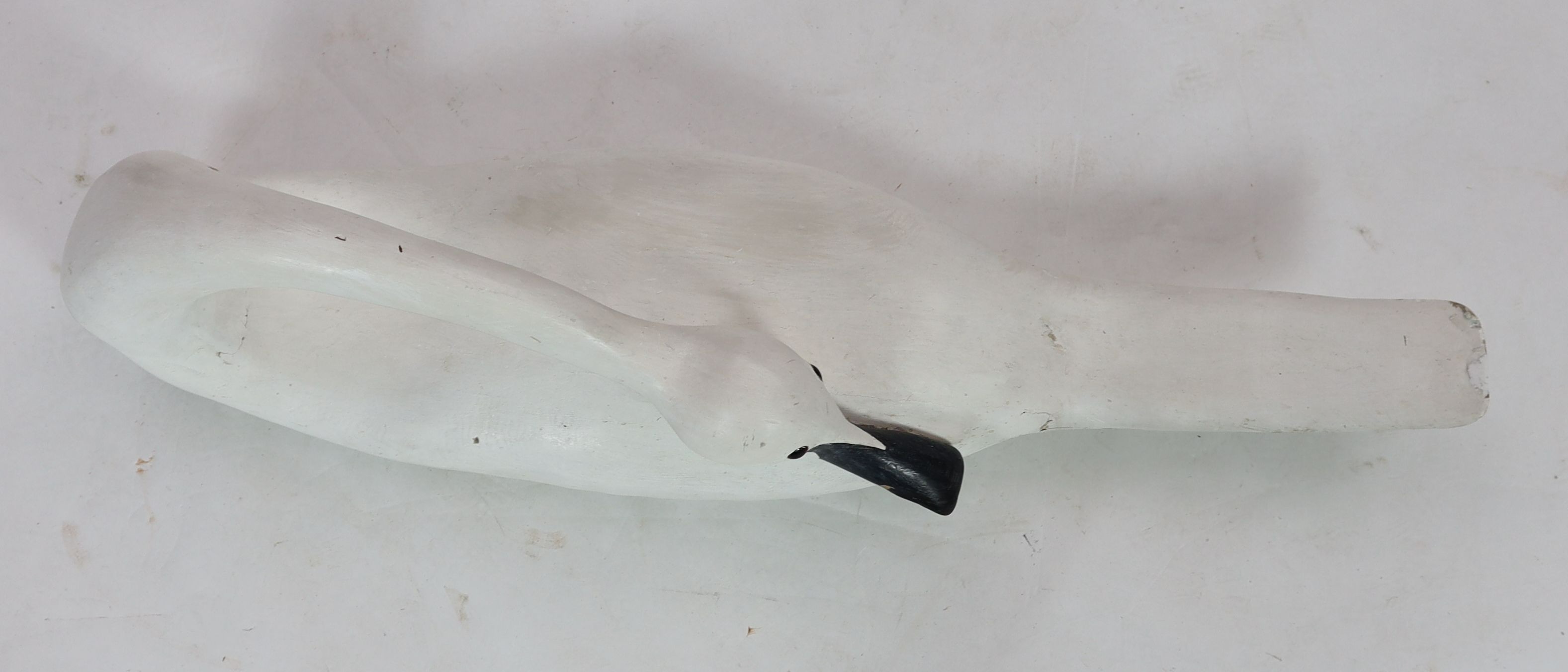 Guy Taplin (b.1939), Swan, carved and painted wood sculpture, length 113cm, depth 29cm, height 33cm